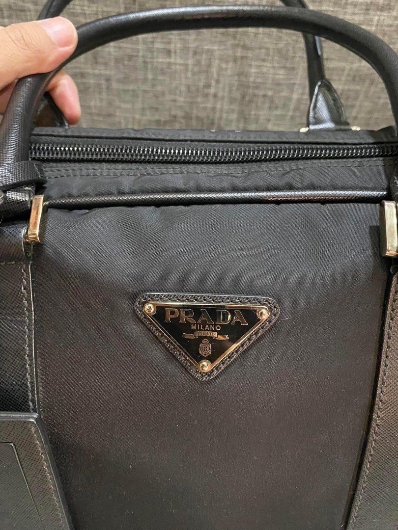 Prada Laptop Bag (Category: Luxury Bags & Wallets) located in Manila. Submitted by bagislifeshop (Listing ID 1293717982, Image 2). Description: 100% Authentic Prada Laptop Bag Condition 9/10 Comes with Standard Dustbag/Authenticity Card .