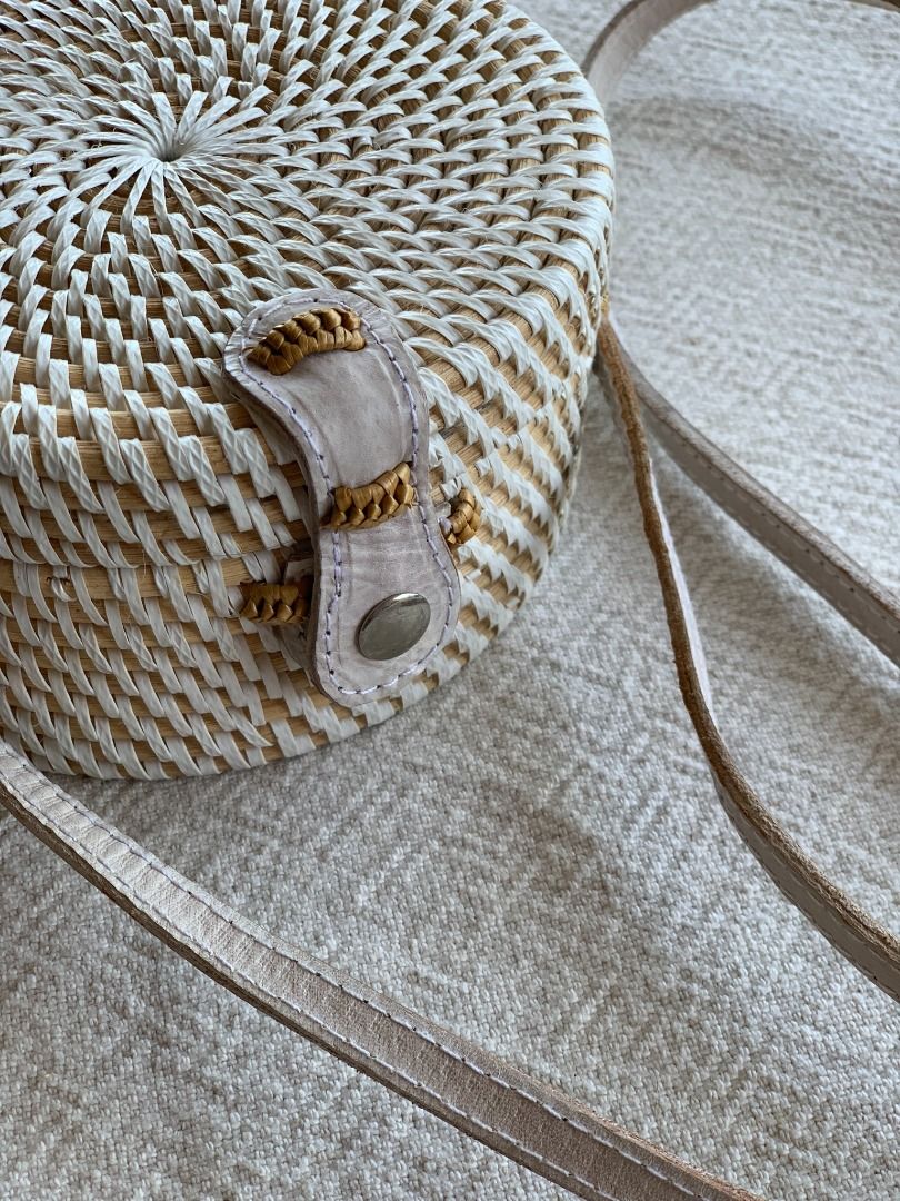 Small Round White Rattan Bag (Category: Cross-body Bags) located in Kuala Lumpur. Submitted by shop.marie.preloved (Listing ID 1293596157, Image 3). Description: ✔️Serious buyers only. ✔️Please read the full item description. Small Round White Rattan Bag Leather strap A vibrant cotton Batik Print on the inside lining Width 15cm / Depth 7.5cm / Length of Strap 115cm Slight discoloration on the inside of the strap and folding (shown in photo 7 and 