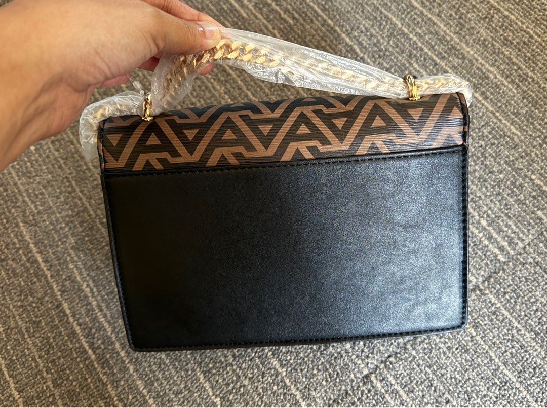 Aldo Triradia Handbag Crossbody (Category: Cross-body Bags) located in Las Pinas. Submitted by jmnb23 (Listing ID 1293768510, Image 3). Description: ORIGINAL Aldo Triradia Handbag / Crossbody - BRANDNEW, never been used - complete packaging Features: Small Crossbody Key Fob Feature Pad Lock Ornament Magnetic Snap Closure Removable Adjustable Shoulder Strap Upper: Synthetic Handle Drop Length: 10 cm Strap Drop Length: 58 cm Height: 15 cm Length: 2