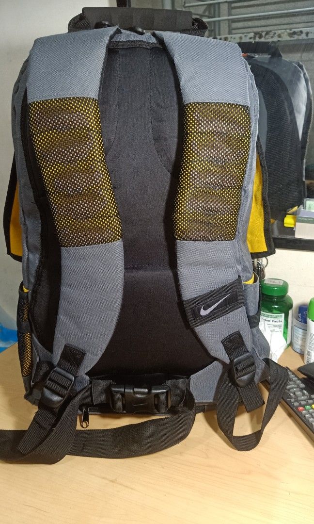 grey and yellow nike backpack