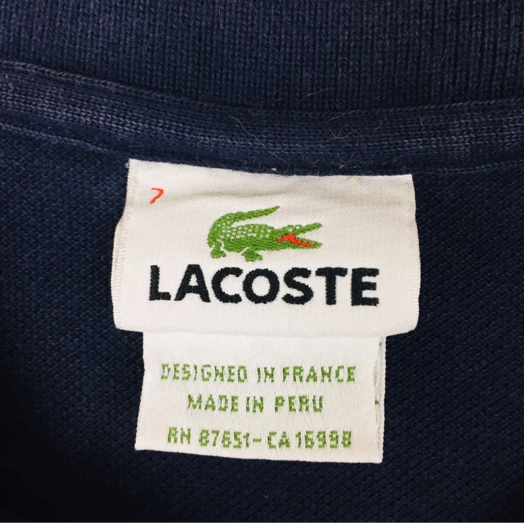 Lacoste Polo Shirt - Navy Blue (Category: Tshirts & Polo Shirts ) located in Paranaque City. Submitted by gabimp (Listing ID 1290642807, Image 2). Description: LACOSTE Men’s Polo Shirt Features: Brand: LACOSTE Slim Fit Style: Polo Size: 7 (XL) (Extra Large) Color: Solid Navy Blue Closure: Button Up (2 Buttons) Collar: Spread Lacoste Log Patch on the Front Left Chest Sleeve: Short Sleeve Shoulder to Shoulder Length: About 18-7/8” Arm Pit to Arm Pi