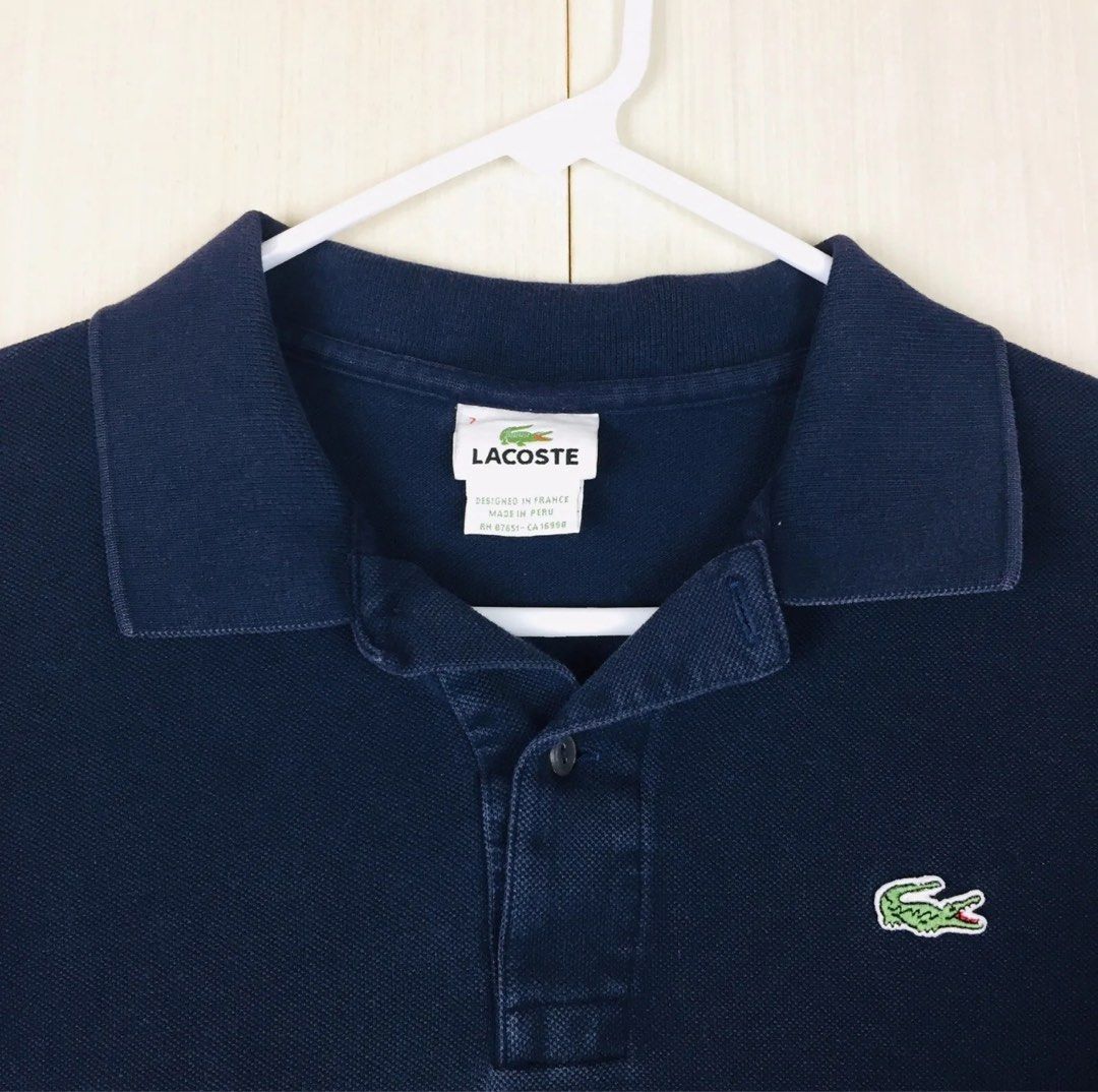 Lacoste Polo Shirt - Navy Blue (Category: Tshirts & Polo Shirts ) located in Paranaque City. Submitted by gabimp (Listing ID 1290642807, Image 3). Description: LACOSTE Men’s Polo Shirt Features: Brand: LACOSTE Slim Fit Style: Polo Size: 7 (XL) (Extra Large) Color: Solid Navy Blue Closure: Button Up (2 Buttons) Collar: Spread Lacoste Log Patch on the Front Left Chest Sleeve: Short Sleeve Shoulder to Shoulder Length: About 18-7/8” Arm Pit to Arm Pi
