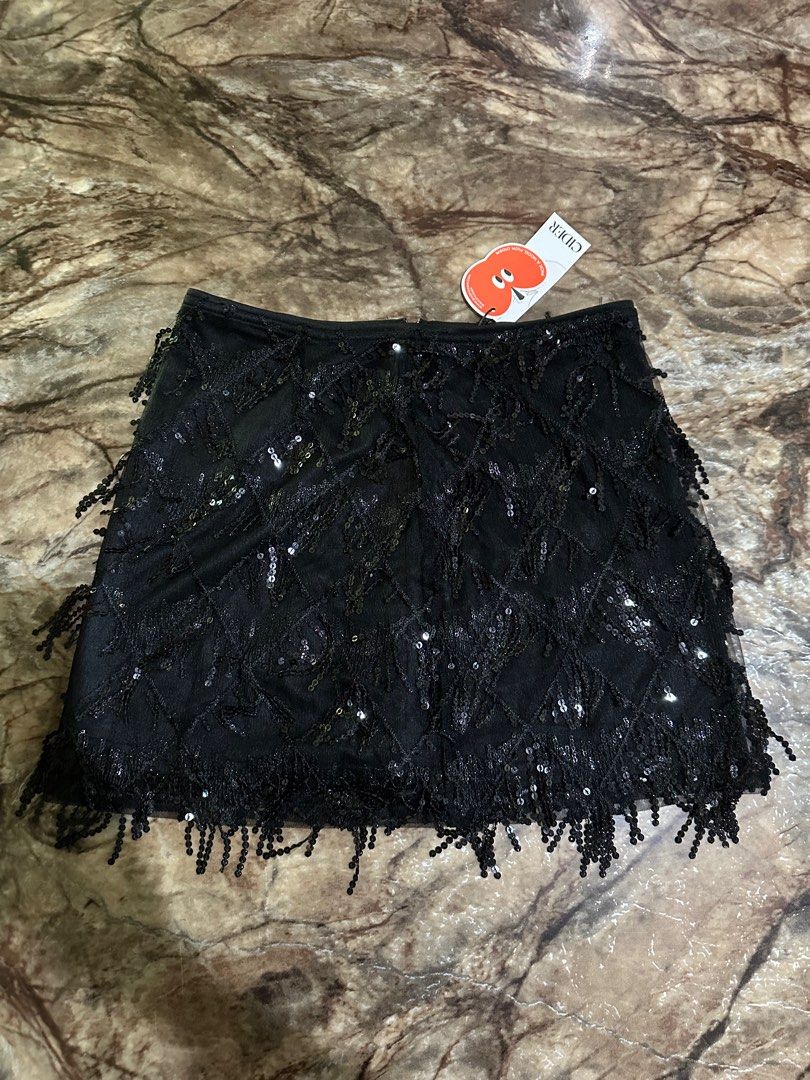 Sequins Tassel Set from CIDER (Category: Sets or Coordinates) located in Arayat. Submitted by jellybelly1 (Listing ID 1290701388, Image 3). Description: Black Sequins Tassel Top and Skirt from CIDER in size Medium ✨ Bought this for ERAS tour but ended up being too big on me. Original Price: PHP 1767 ✨ Selling it for PHP 1400 only Sf by buyer 🩵.