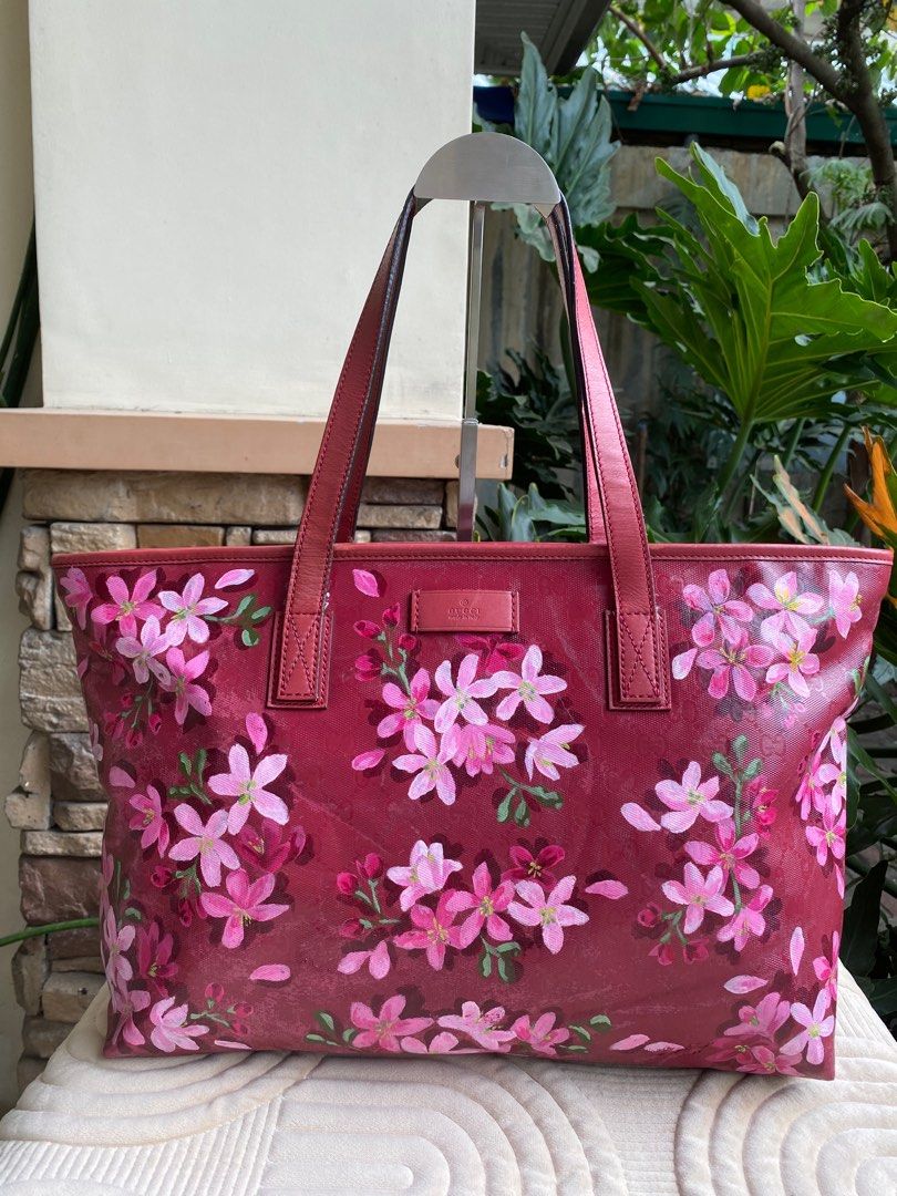 GUCCI Hand Painted Tote Bag (Category: Luxury Bags & Wallets) located in Baliuag. Submitted by nylinel (Listing ID 1293941133, Image 1). Description: 👜 GUCCI Hand Painted Tote Bag 🇮🇹 Project bag: hand painted by local artist 🌸 Design: Palawan cherry blossom 💼 Color red ⛔️ Size: L- 18” x H- 13” 👛 Guaranteed authentic 💯 with cards, receipt 🎒 preloved - in good condition.