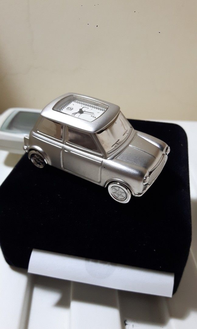 Solid silver Mini Morris clock. (Category: Vintage Collectibles) located in Singapore. Submitted by mokeman (Listing ID 1294028551, Image 2). Description: Brand new, kept in box long time, bty taken out but not sure if still works as bought it to display in my Mini car collection only. Very solid n heavy, bought frm the U.K. cash n carry..