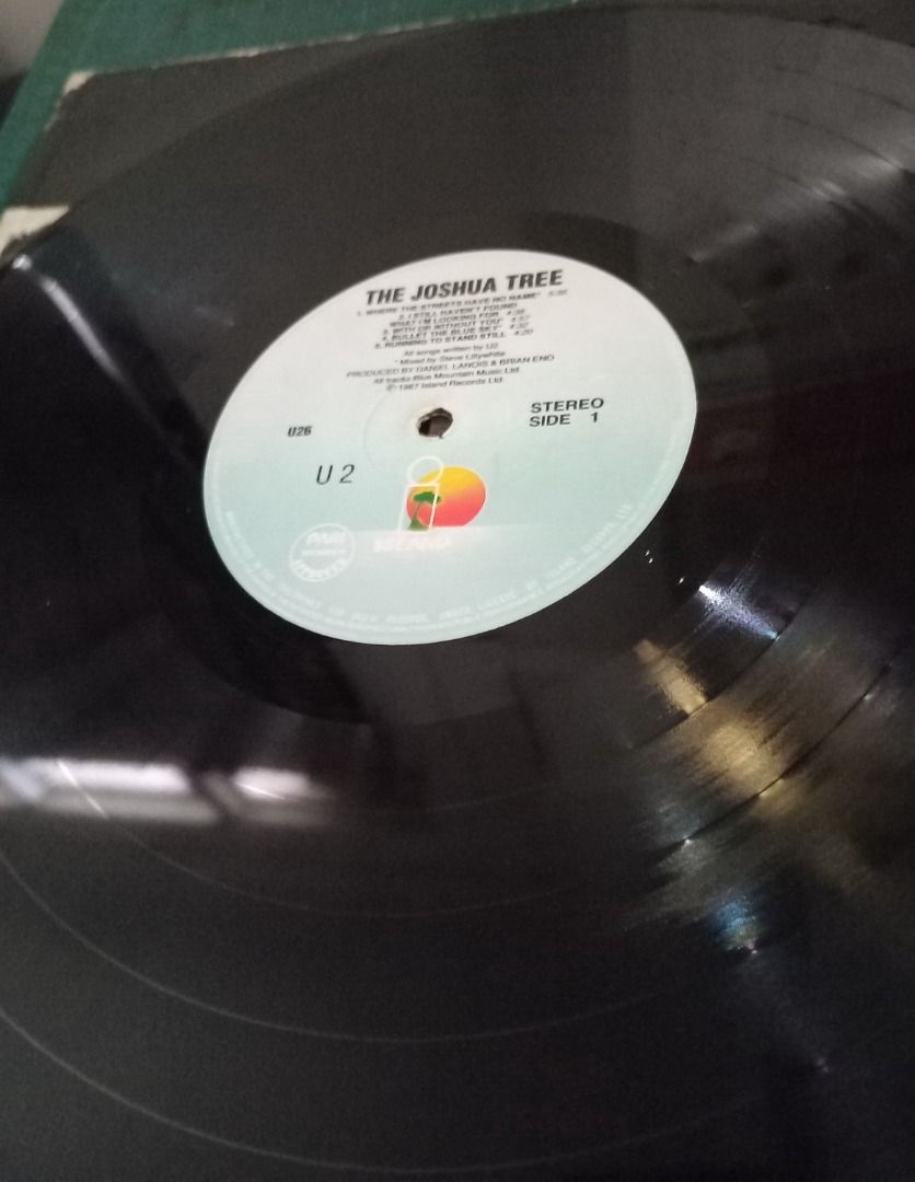 U2, Joshua Tree LP #94 (Category: Vinyls) located in Iloilo. Submitted by cdex.200300 (Listing ID 1293949586, Image 3). Description: Description: “Joshua Tree” U2 Long-Playing Album Remarks: • My collection from the 80s during my DJ mixing days. Sometimes it’s hard to let go. • The inner sleeve is still intact. • The vinyl record is in good condition, but there are a few pits that seem like factory defects. • No major scratches that can cause nee