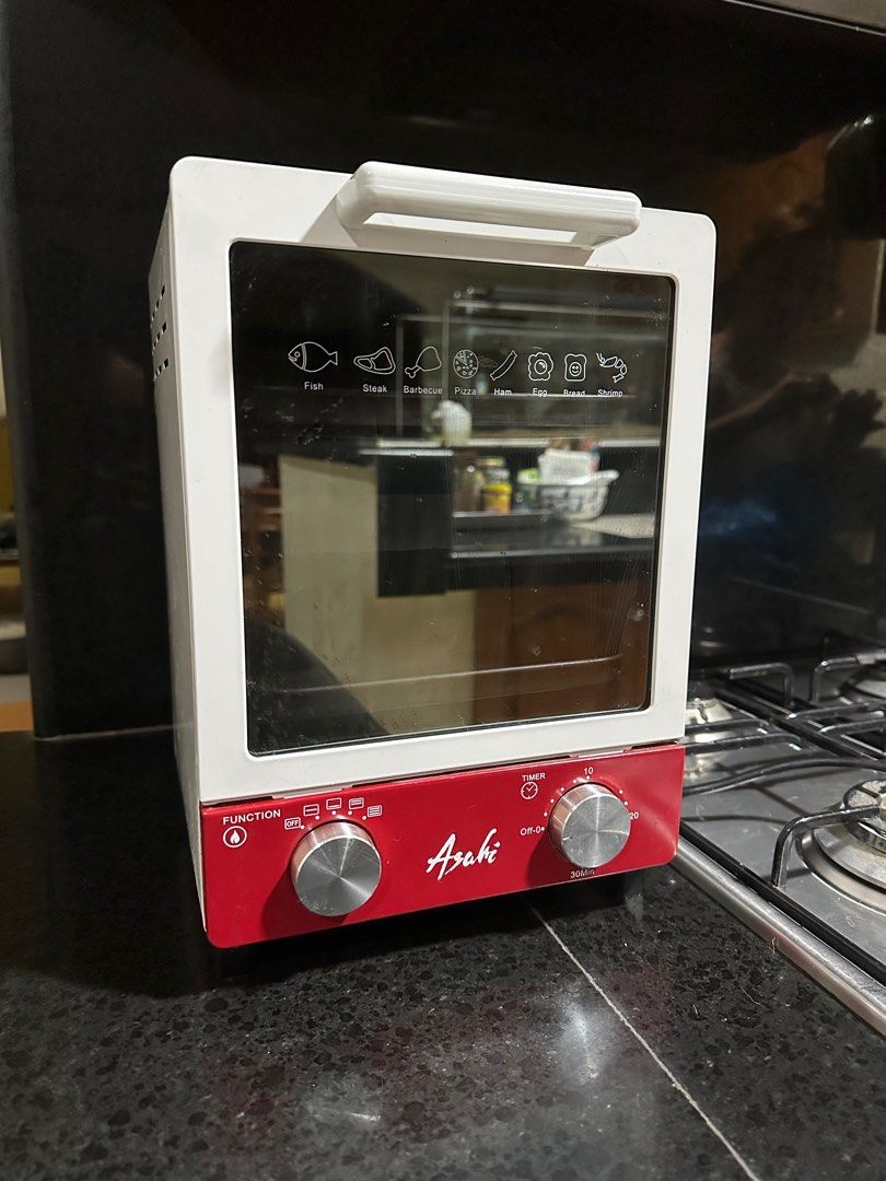 Asahi Oven Toaster (Category: Ovens & Toasters) located in San Fernando. Submitted by randomstuffphilippines (Listing ID 1294223927, Image 1). Description: 1,000W 30-minute timer with bell Thermostat controlled heating operation Powder coated steel body One way tinted glass door 3 ceramic heating tubes Double insulated AC cord 2 food trays Dimension (LxWxH): 225 x 245 x 325 mm.