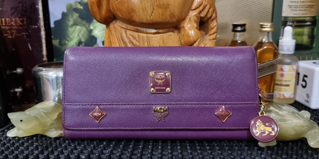 MCM Lioness tri fold long wallet Original (Category: Luxury Bags & Wallets) located in Makati City. Submitted by lilyignacio81 (Listing ID 1294274347, Image 1). Description: personal collection BTS ARMY Enter the realm of luxury and sophistication with the MCM Lioness Tri-Fold Long Wallet – an original masterpiece that exudes elegance and exclusivity. Crafted with precision and attention to detail, this wallet isn't just an accessory; it's a symb