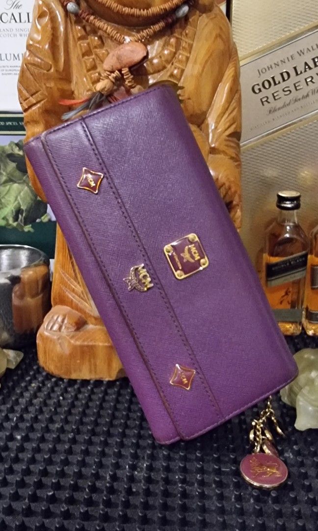 MCM Lioness tri fold long wallet Original (Category: Luxury Bags & Wallets) located in Makati City. Submitted by lilyignacio81 (Listing ID 1294274347, Image 2). Description: personal collection BTS ARMY Enter the realm of luxury and sophistication with the MCM Lioness Tri-Fold Long Wallet – an original masterpiece that exudes elegance and exclusivity. Crafted with precision and attention to detail, this wallet isn't just an accessory; it's a symb