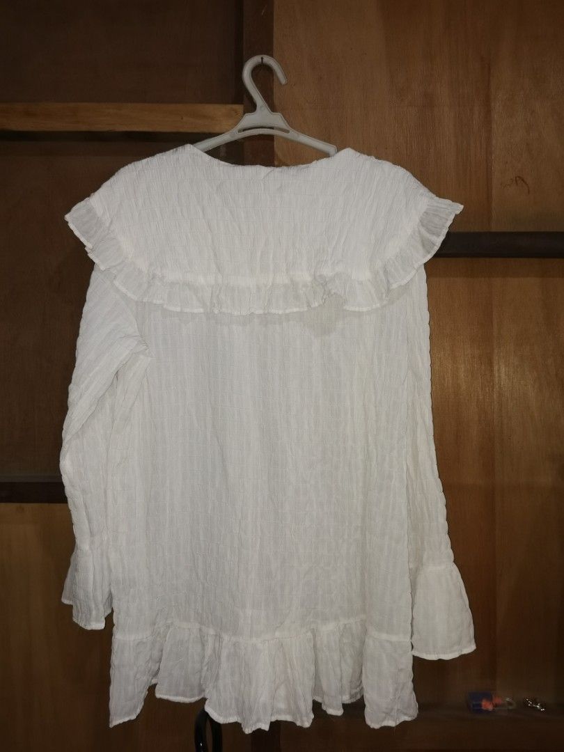 White ethereal blouse with wide collars (Category: Blouses) located in Paranaque City. Submitted by plussizedec (Listing ID 1294192461, Image 2). Description: Bought in Baguio. RFS:Decluttering Items are personal owned items. Used but not abused. Some don't fit anymore, others I have outgrown the style..