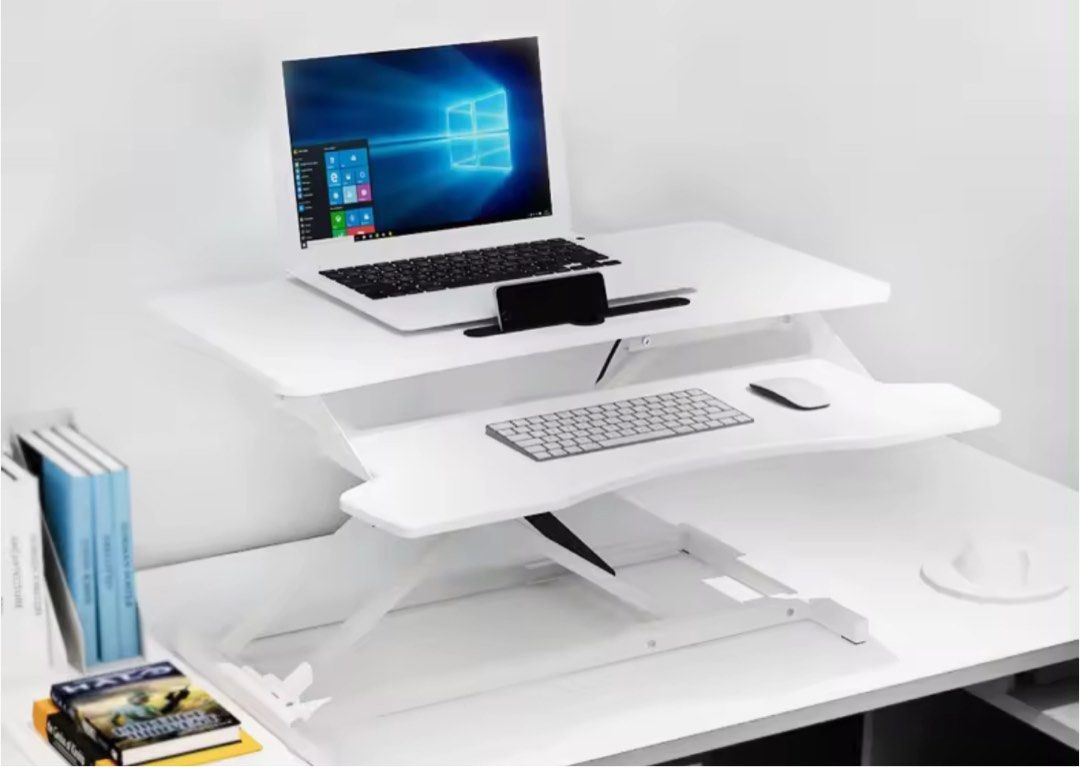 Adjustable standing table (Category: Tables & Sets) located in Singapore. Submitted by sampson1 (Listing ID 1294348409, Image 2). Description: The table can be adjusteded up and down, it goods if to avoid sedentary. Dimension 80x40cm. Self collect at my place or arrange lalamove to collect if you are keen at 321016.