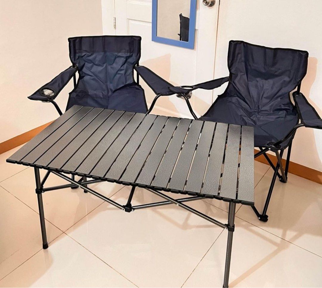 Foldable Camping chairs and table set (Category: Hiking & Camping) located in Makati City. Submitted by apricooutdoors (Listing ID 1294325470, Image 2). Description: *AVAILABLE AS LONG AS STILL POSTED* P350 each chair P1,650 for 1 SET 2 chairs (black or navy blue) 1 XL foldable table (95cm) .