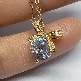 Moissanite Necklace. Ribbon design. 18K gold plated pendant. Gold plated Stainless Chain.