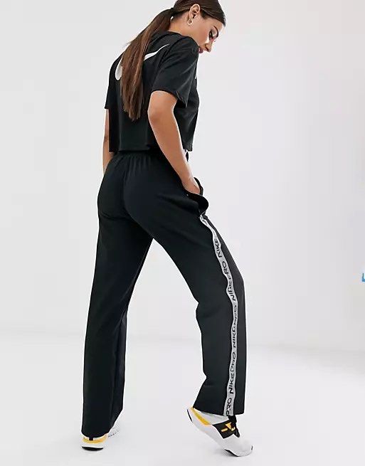 Nike Pro Training popper detail trousers in black, Women's Fashion,  Bottoms, Other Bottoms on Carousell