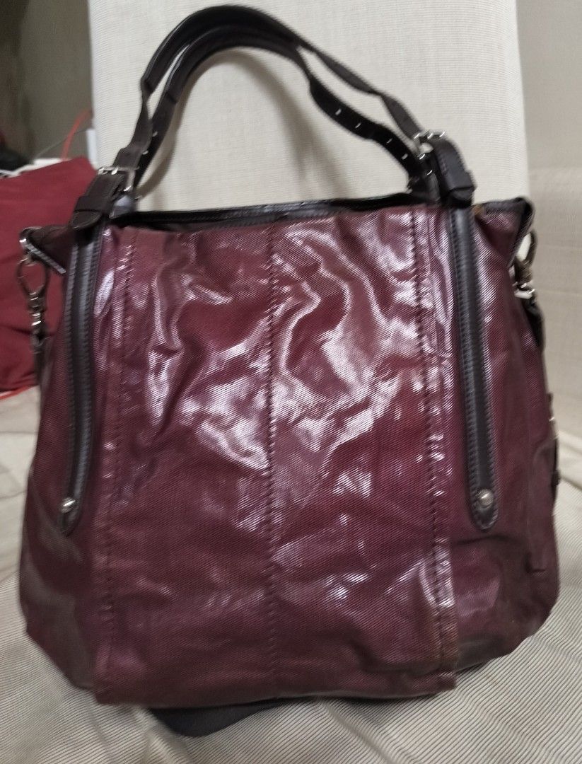 Authentic Tod's 2 way Sacca Tote (Category: Luxury Bags & Wallets) located in Taguig. Submitted by airam3001 (Listing ID 1294303862, Image 2). Description: Exterior Material :Coated Canvas and Leather Interior Material:Nylon Measurements (+-) L: 35.5 cm W: 18.5 cm Height:28.5 cm Handle Drop:20.5 cm (can be adjusted) Shoulder Strap: 50 cm (adjustable/detachable and in very good condition) SHW Flaws on 2 photos before last but can be used for years