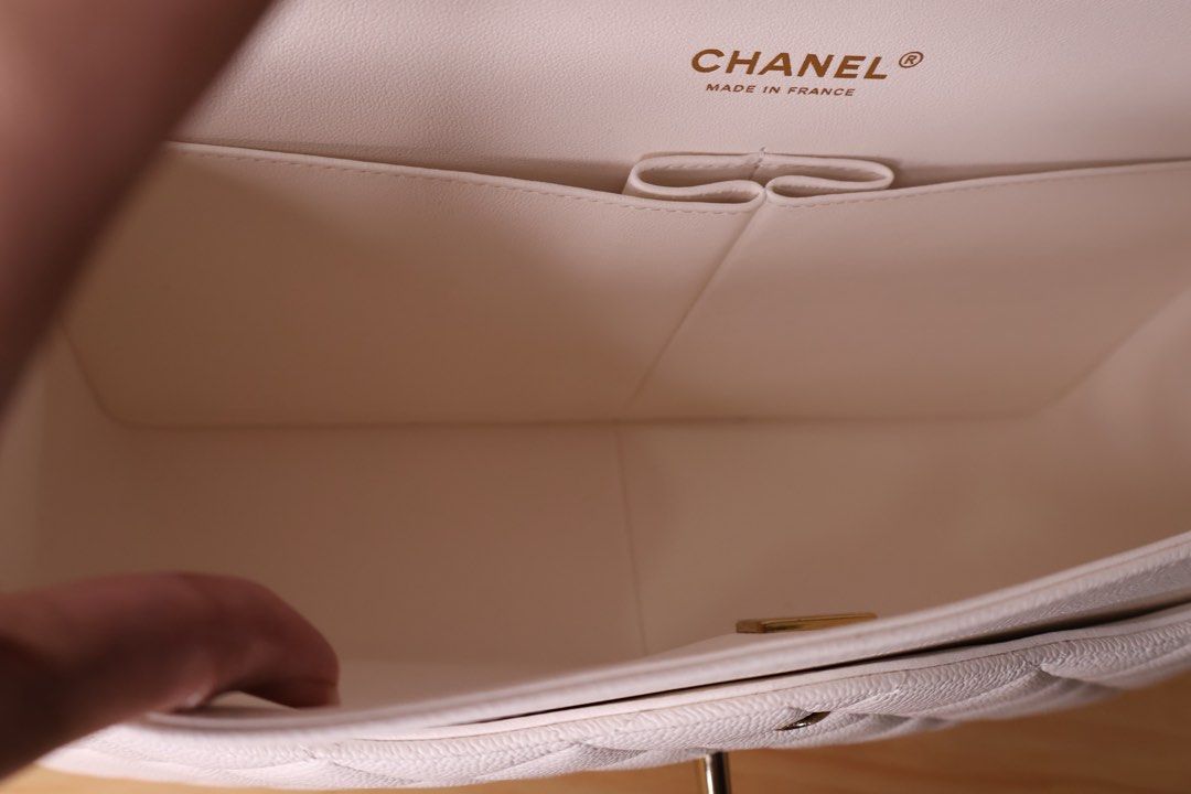 Chanel Double Flap Caviar Jumbo (Category: Luxury Bags & Wallets) located in Caloocan City. Submitted by thefancy101luxurymanila (Listing ID 1294581835, Image 3). Description: Chanel Double Flap Caviar Jumbo ✅ Brand new. Rank SA ✅ Gold toned hardware ✅ Jumbo size caviar in white ✅ Microchipped year of purchase: 2023 ✅ Comes in complete inclusions. Box, Paper bag, Dust bag, cloth, certificate of purchase, receipt, camelia flowers and ribbons ✅ Cas