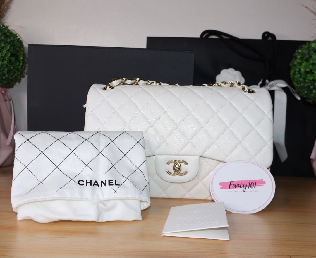 Chanel Double Flap Caviar Jumbo (Category: Luxury Bags & Wallets) located in Caloocan City. Submitted by thefancy101luxurymanila (Listing ID 1294581835, Image 1). Description: Chanel Double Flap Caviar Jumbo ✅ Brand new. Rank SA ✅ Gold toned hardware ✅ Jumbo size caviar in white ✅ Microchipped year of purchase: 2023 ✅ Comes in complete inclusions. Box, Paper bag, Dust bag, cloth, certificate of purchase, receipt, camelia flowers and ribbons ✅ Cas