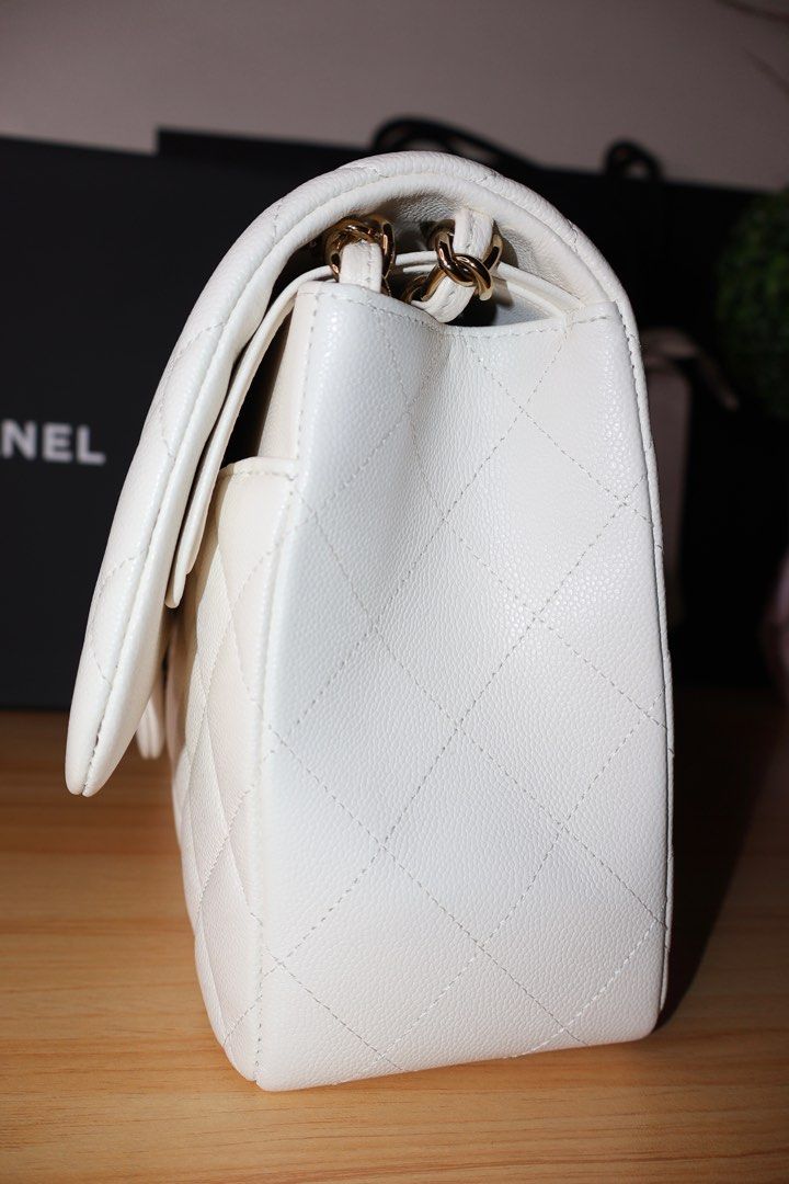 Chanel Double Flap Caviar Jumbo (Category: Luxury Bags & Wallets) located in Caloocan City. Submitted by thefancy101luxurymanila (Listing ID 1294581835, Image 2). Description: Chanel Double Flap Caviar Jumbo ✅ Brand new. Rank SA ✅ Gold toned hardware ✅ Jumbo size caviar in white ✅ Microchipped year of purchase: 2023 ✅ Comes in complete inclusions. Box, Paper bag, Dust bag, cloth, certificate of purchase, receipt, camelia flowers and ribbons ✅ Cas