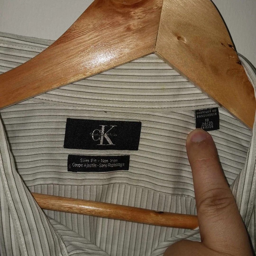 CK Slim Fit Long Sleeves (Category: Formal Shirts) located in Plaridel. Submitted by thrift.85 (Listing ID 1294448697, Image 3). Description: Item: CK Slim Fit Long Sleeves Price: ₱250 + shipping fee Condition and Quality: Pre-owned - Well Used | 9.7/10 Color and Rating: White/Green | 10/10 Size and Dimes: XXL | 31L x 23W Description: Some washable stains on collar Mode of Payment: GCash / Maya / Bank Transfer / PayPal Courier: J&T Express Please