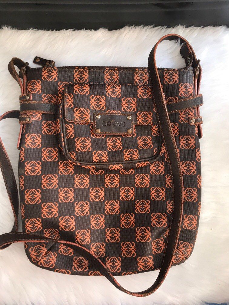 loewe anagram sling bag (Category: Luxury Bags & Wallets) located in Antipolo. Submitted by prelovedcloseta (Listing ID 1294507927, Image 1). Description: auth loewe bag sling or cross body bag preloved with signs of usage need restoration edging and corners with small pouch (detachable) price in the internet 15k above (preloved) .