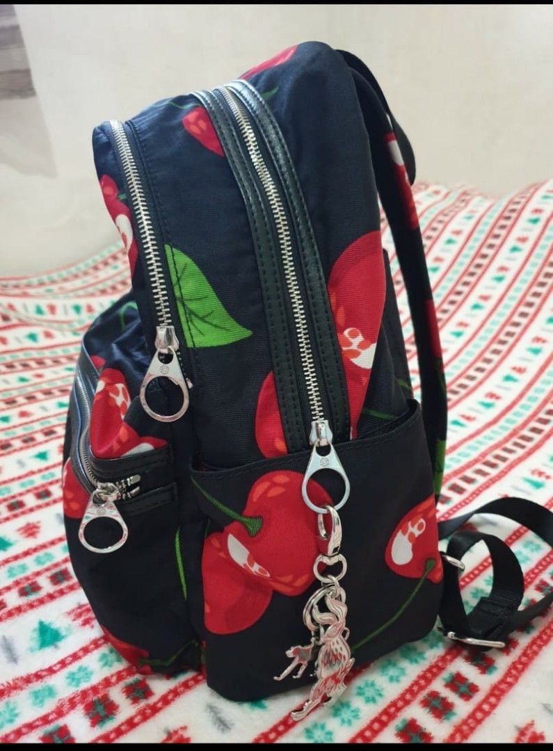 ORIGINAL Kipling Cherry Backpack (Category: Luxury Bags & Wallets) located in Marikina City. Submitted by arc_co. (Listing ID 1294457151, Image 3). Description: Women Cherry Print Back Pack 38 H x 36 L x 14 W cm Black/Red With laptop compartment Bought and stored only can pass as brand-new.