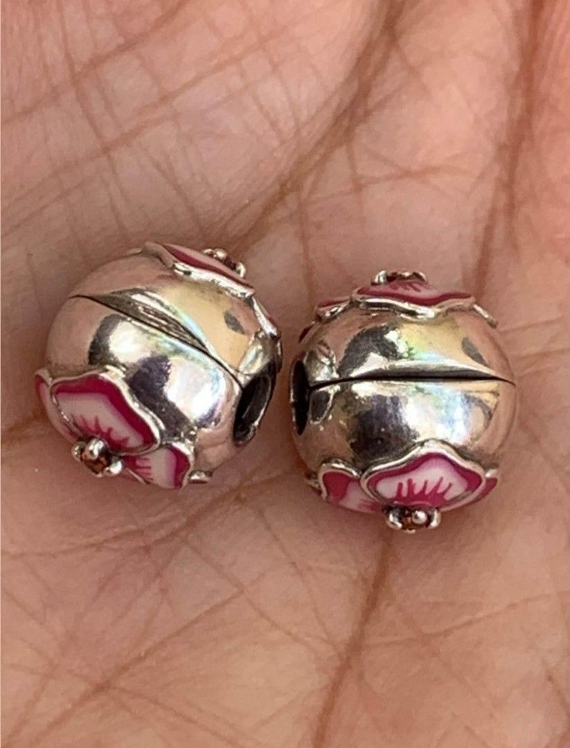 Pandora Pansy Flower Clip Charm Pair (Category: Bracelets) located in Cainta. Submitted by cookie8186 (Listing ID 1294616630, Image 3). Description: Authentic. See markings, can be cleaned to any Pandora store. Very good condition, barely used. Price for pair. Selling in pairs only. gcash/lalamove j&t. Can be pick-up at Parang Marikina..
