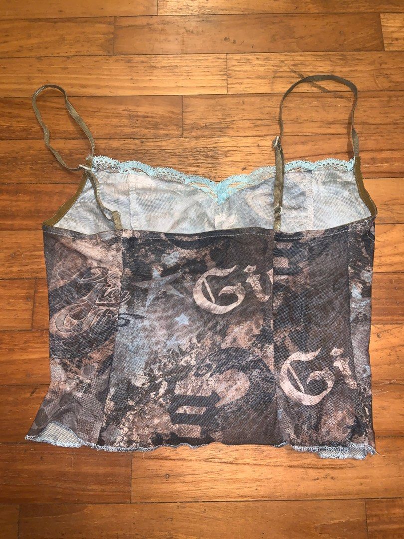 Brown printed mesh cami (Category: Sleeveless) located in Singapore. Submitted by lucindaaaaa (Listing ID 1294787708, Image 2). Description: Stretchy mesh material Fits up to S, small M Adjustable straps.