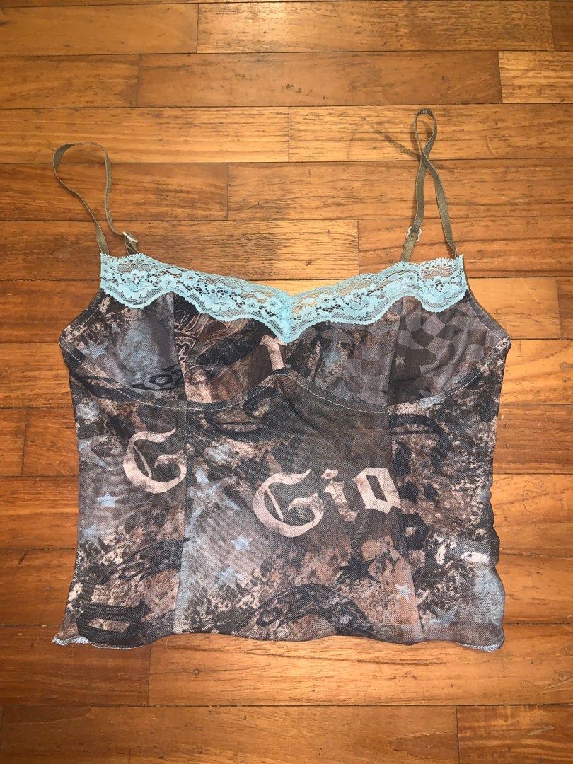 Brown printed mesh cami (Category: Sleeveless) located in Singapore. Submitted by lucindaaaaa (Listing ID 1294787708, Image 1). Description: Stretchy mesh material Fits up to S, small M Adjustable straps.