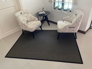 Coffe table with two arm chair and carpet