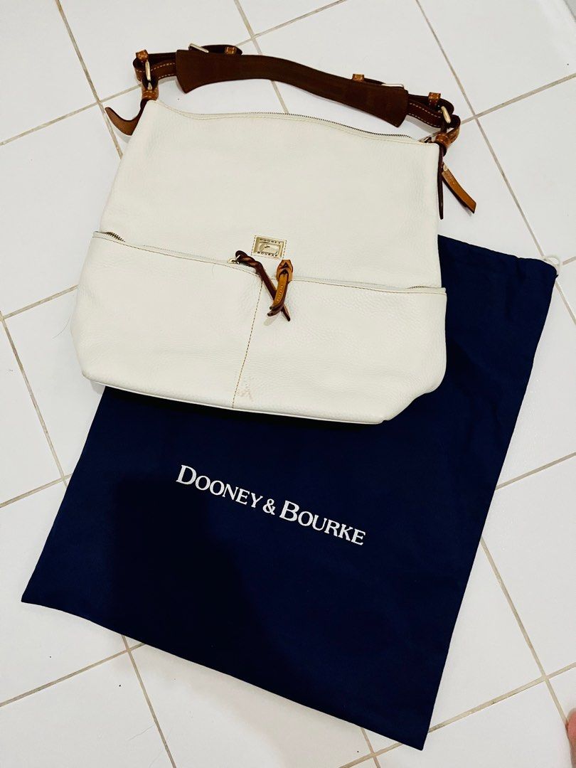 DOONEY & BOURKE - White leather bag (Category: Shoulder Bags) located in Bulacan. Submitted by declutterwitharia (Listing ID 1294732201, Image 2). Description: Authentic DOONEY & BOURKE comes with og dust bag very good & makapal na leather Spacious inside White leather, with some stain on front. not very noticeable. (see pictures posted).