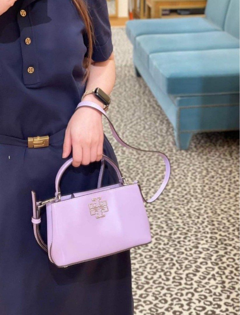 💯ORIGINAL TORY BURCH BRITTEN TOP HANDLE LILAC (Category: Luxury Bags & Wallets) located in Quezon City. Submitted by ashongsstore (Listing ID 1294757278, Image 2). Description: ➕TÖRY BÜRÇH COLLECTION➕ 🇵🇭ONHAND🇵🇭 Britten Chain Wallet, Crossbody and Wristlet in 1 ‼️Please look at our pictures as that is exactly what you are purchasing‼️ 10000% Original Not REPLICA, OEM, TOP GRADE QUALITY, AUTHENTIC QUALITY or Any other Terms to DENOTE FAKE! 😎