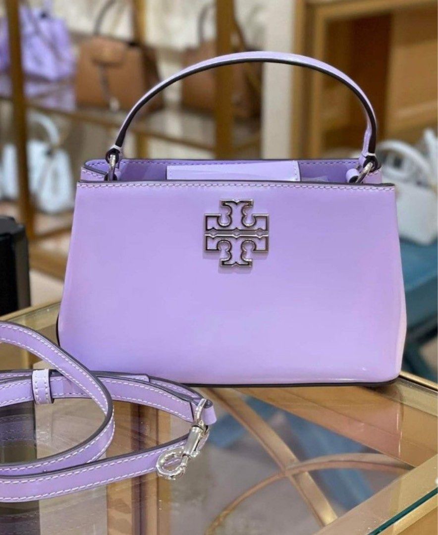 💯ORIGINAL TORY BURCH BRITTEN TOP HANDLE LILAC (Category: Luxury Bags & Wallets) located in Quezon City. Submitted by ashongsstore (Listing ID 1294757278, Image 1). Description: ➕TÖRY BÜRÇH COLLECTION➕ 🇵🇭ONHAND🇵🇭 Britten Chain Wallet, Crossbody and Wristlet in 1 ‼️Please look at our pictures as that is exactly what you are purchasing‼️ 10000% Original Not REPLICA, OEM, TOP GRADE QUALITY, AUTHENTIC QUALITY or Any other Terms to DENOTE FAKE! 😎