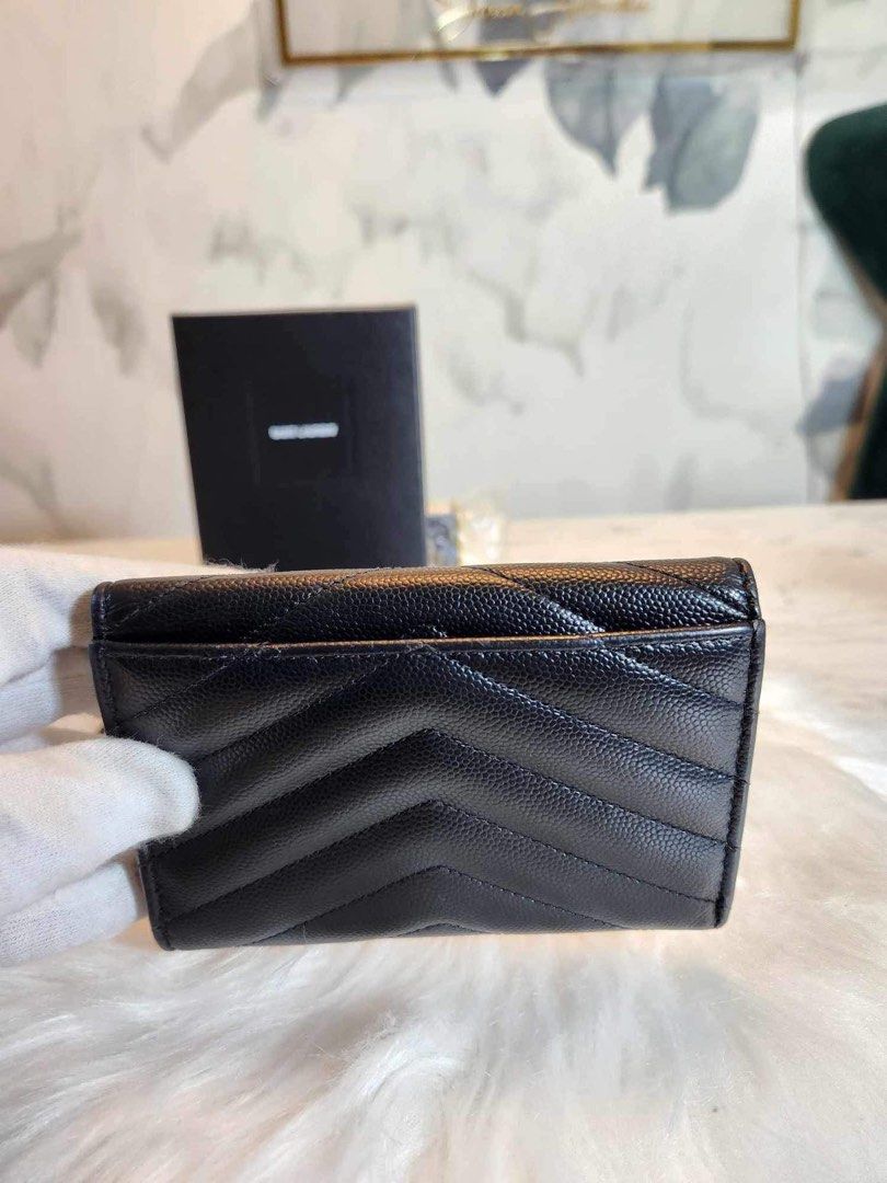 Saint Laurent YSL black compact wallet in silver hardware (Category: Luxury Bags & Wallets) located in Manaoag. Submitted by intheseoulph.shark (Listing ID 1294795504, Image 3). Description: Saint Laurent YSL black compact wallet in silver hardware Snap closure not too tight .