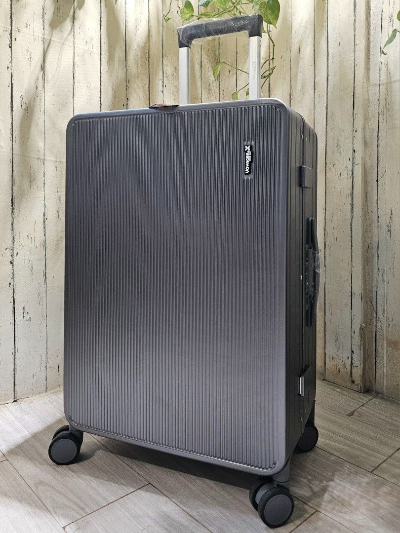 Voyager X medium hard case zipperless luggage Hobbies Toys Travel Luggage on Carousell