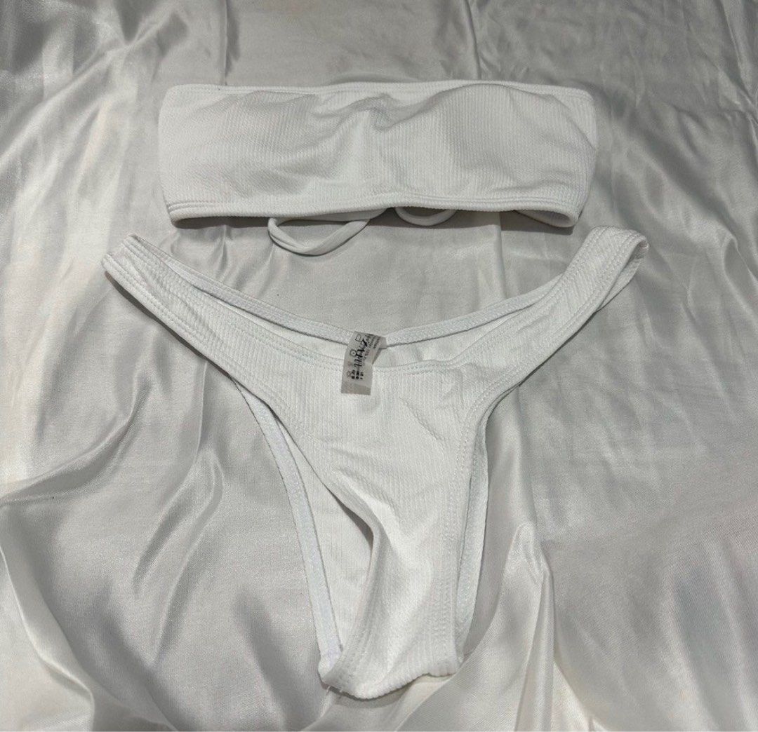 Zaful bandeau swimsuit bikini - white (Category: Bikinis & Swimsuits) located in Binangonan. Submitted by decsssss (Listing ID 1294712559, Image 1). Description: Used once. Size small on tag, bottom (not used) is kinda sikip on me. I am 32-27-34 for reference. Note: notice thè different shades of white sa when worn? i am wearing a different bottom in the pic because masikip ung nasa original set.