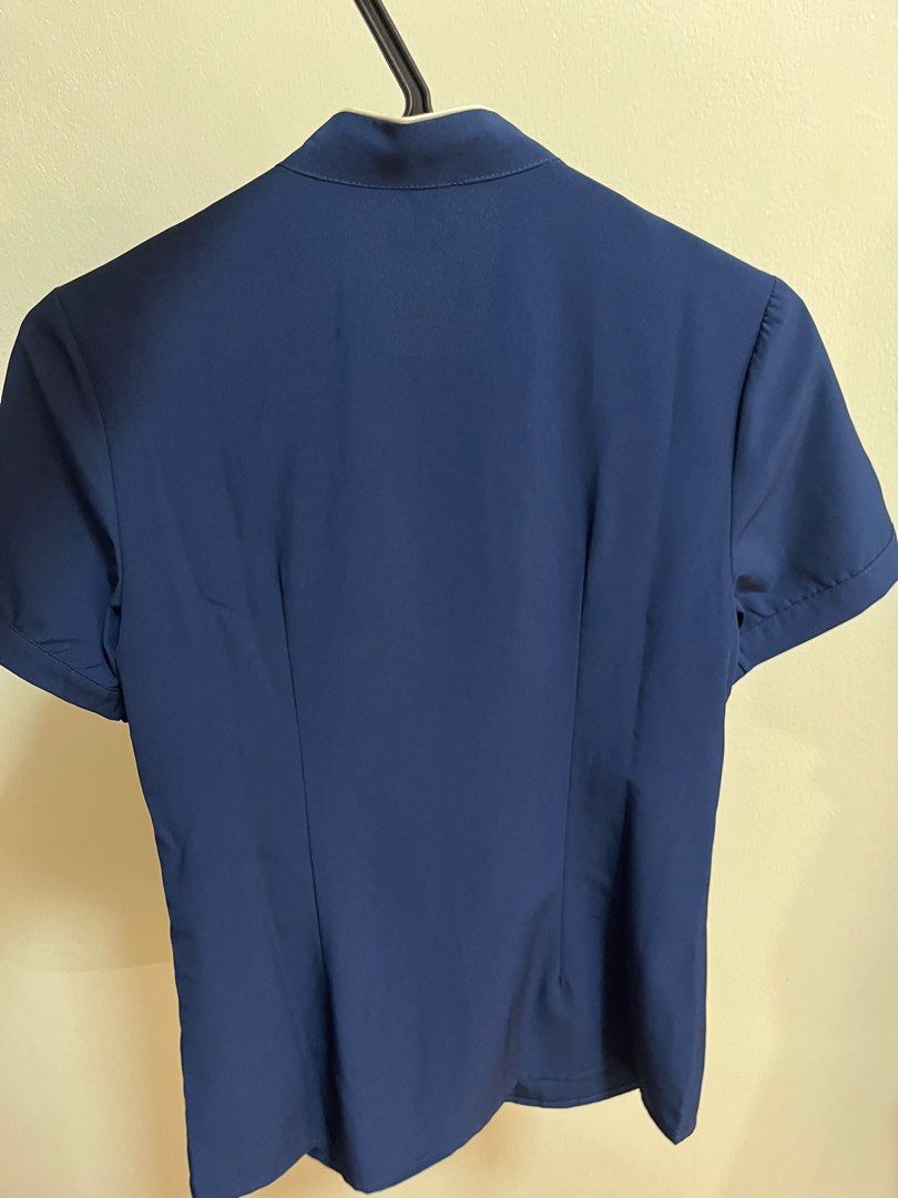 Blue blouse with ribbon from Well-Suited (Category: Blouses) located in Quezon City. Submitted by mimidecluttering (Listing ID 1295094458, Image 2). Description: No tags but never used Bought from Well Suited Size s Buttons are hidden 📦 Shipping c/o buyer (pick up near Katipunan, Quezon City) 📦 Can ship J&T or LBC for cheaper delivery; Lalamove or Grab for same day delivery.