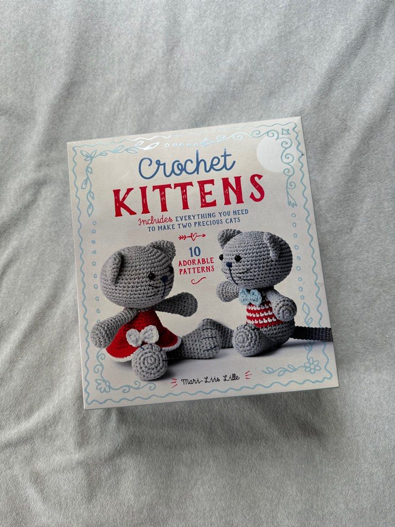 Crochet Amigurumi Kit (Category: Handmade Craft) located in Pasig City. Submitted by speerow (Listing ID 1295039177, Image 1). Description: Complete set. Makes 2 amigurumi kitten. Contents: 1 book, 4 ball of yarn in three different colors, plus four yards of blue yarn, 1 crochet hook, 1 embroidery needle, 2 pairs plastic eyes, black embroidery floss, 1 bag stuffing Book has guide plus more amigurumi patterns.