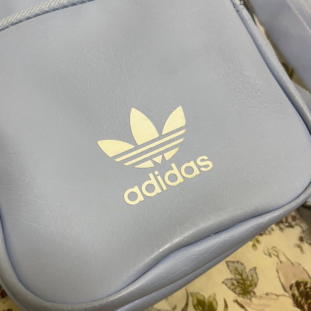 Adidas Mini Backpack in Light Blue (Category: Cross-body Bags) located in Las Pinas. Submitted by thevallerys (Listing ID 1295306263, Image 3). Description: Bought in SG for 2400 in Adidas store Can be worn as backpack, or crossbody sling! Used once only, didnt reach out for it anymore because too many bags See photos for slight discolouration on strap and some marks on the logo.