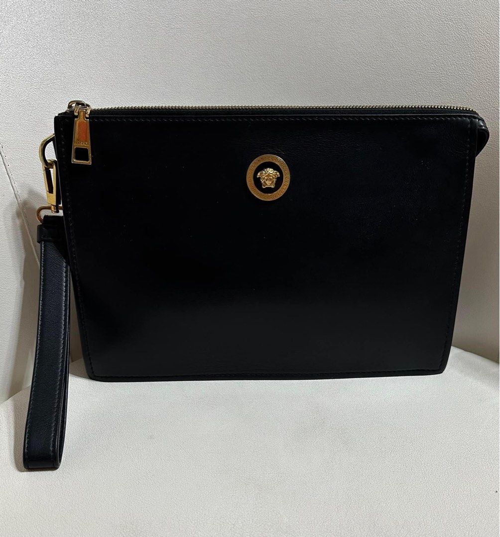 Authentic Versace/marked down (Category: Luxury Bags & Wallets) located in Manila. Submitted by chloe_luxuries (Listing ID 1295297053, Image 1). Description: Guaranteed original Versace wrislet clutch Still in very good condition No inclusion bag only Pm for kore details.