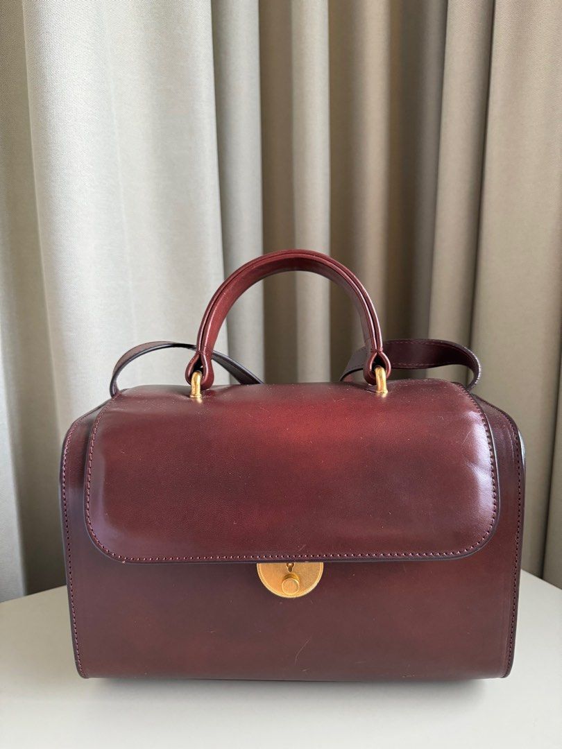Maison Margiela Burgundy Doctors bag (Category: Bags & Wallets) located in Singapore. Submitted by anyhowbakery (Listing ID 1295273566, Image 1). Description: Used a few times in excellent condition .
