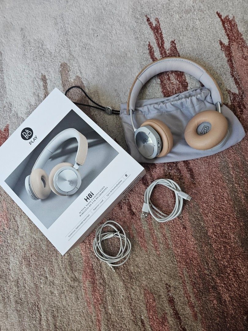 Bang and Olufsen H8i (Category: Headphones & Headsets) located in Taguig. Submitted by rochev (Listing ID 1295397427, Image 1). Description: Premium Bang and Olufsen H8i active noise cancellation wireless on-ear headphones. Up to 30 hours playtime, luxurious lightweight material, superior sound, fashionable. Comes with box, pouch, quick start guide manual, charger wire and speaker wire. Bought in Greenbelt..