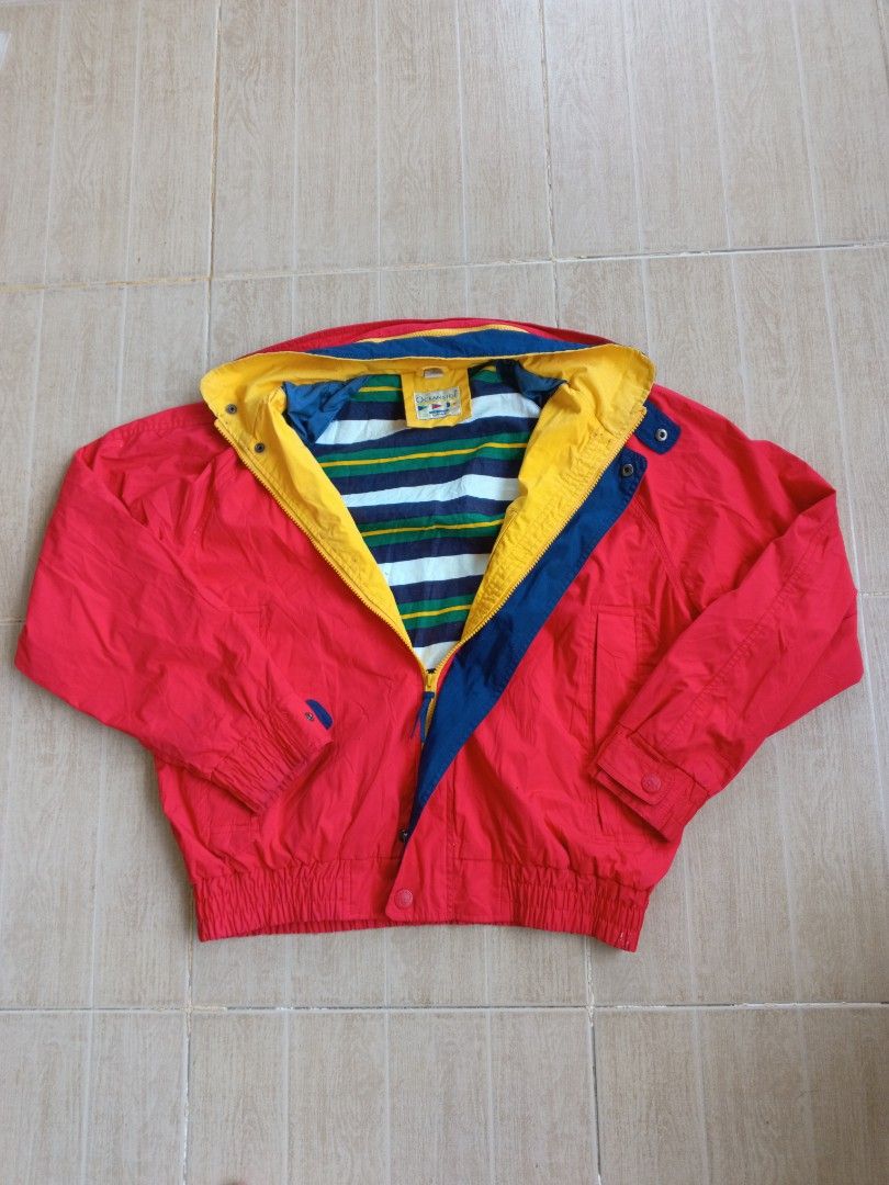 Vintage 90s Oceanside Sailing Windbreaker Jacket (Category: Coats, Jackets and Outerwear) located in Tagum. Submitted by _mr.thrifter (Listing ID 1295462329, Image 2). Description: Polyester cotton shell, cotton lining Full zip with hidden hood, side pockets Colorblock red, yellow blue Nautical themed.