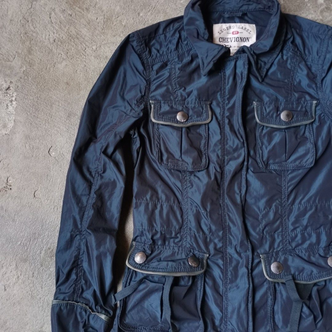 Chevignon Nylon Cargo Biker Jacket (Category: Coats, Jackets and Outerwear) located in Rodriguez. Submitted by tygryskus_picks (Listing ID 1290971698, Image 2). Description: Nylon Material Leather Trimmings has wire on every corner to alter the fit Width - 16" Length - 23.5".