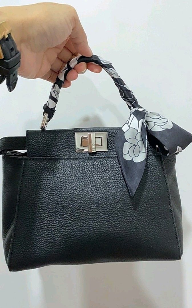 Fendi Mini Peekaboo (Category: Luxury Bags & Wallets) located in Makati City. Submitted by xie10474 (Listing ID 1295760249, Image 1). Description: Genuine Pebbled Leather Coded, with Care card and Dust bag No flaws, no issues Minimal hair line on twist-lock Japan-sourced RFS: Decluttering.