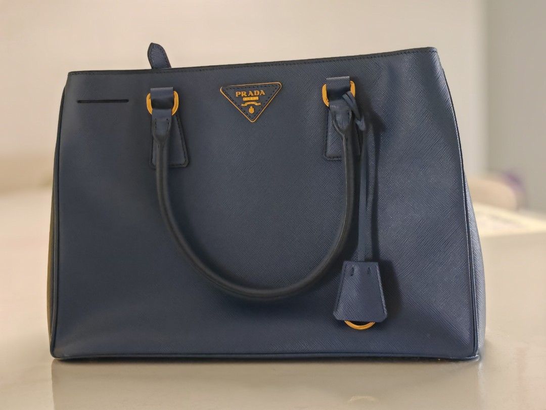 Prada *authentic (Category: Bags & Wallets) located in Singapore. Submitted by pisping (Listing ID 1295779049, Image 1). Description: Authentic prada bag in blue. Pm me for fast deal.