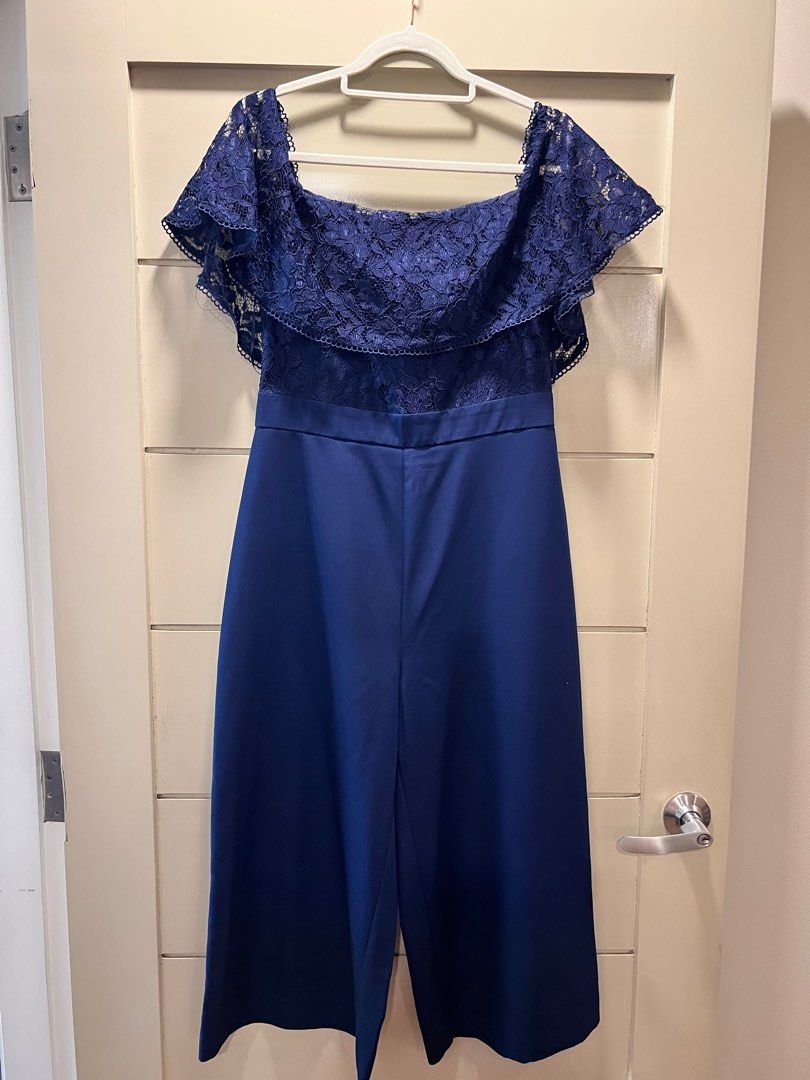 Warehouse navy blue lace romper UK12 (Category: Jumpsuits) located in Mandaluyong City. Submitted by sjo88 (Listing ID 1295766509, Image 1). Description: Warehouse navy blue lace romper / jumpsuit Excellent condition. Off-shoulder. Very elegant when worn. Rfs: too big PRICE IS FIRM.