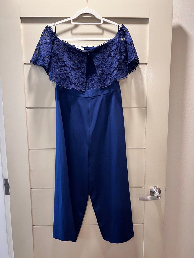 Warehouse navy blue lace romper UK12 (Category: Jumpsuits) located in Mandaluyong City. Submitted by sjo88 (Listing ID 1295766509, Image 3). Description: Warehouse navy blue lace romper / jumpsuit Excellent condition. Off-shoulder. Very elegant when worn. Rfs: too big PRICE IS FIRM.
