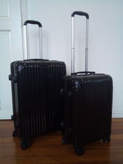 2 cabin size and medium size black hard case luggage bundle