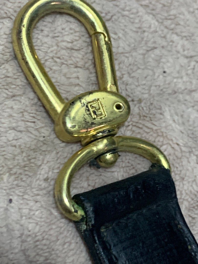 Authentic Vintage Fendi Bag Strap (Category: Luxury Bags & Wallets) located in Rosario. Submitted by myvinatgepieces (Listing ID 1295979337, Image 2). Description: Authentic Vintage Piece 44” Length With Visible signs of wear Non adjustable With some faded / scratches hardware and leather Perfect for top handle bags Check posted pics .