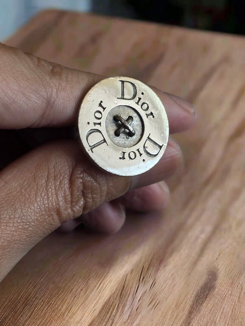 Dior Button Ring (Category: Luxury Accessories) located in Pasig City. Submitted by kimjayson (Listing ID 1295879459, Image 1). Description: Vintage Rare Dior Button Ring size - Adjustable back meet up - Tiendesitas / SM Center Pasig Delivery - Lalamove/Grab payment - Gcash/BPI ( Payment upon picking up and verifying with your rider that the item is correct and as posted..